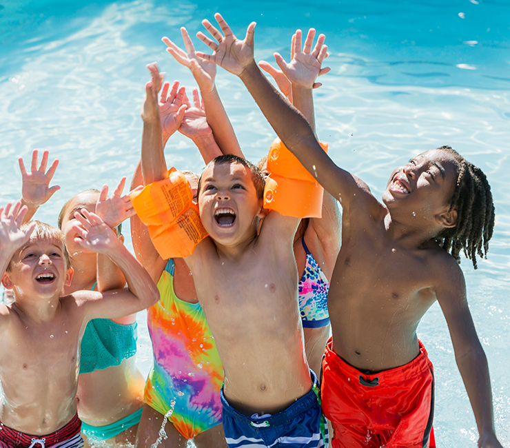 Group of children enjoying water games during Bahia Resort Hotel's Spring Activities in Mission Bay, San Diego, CA.