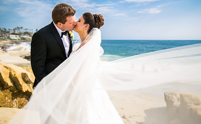 Bride and Groom kissing at their Beach Wedding