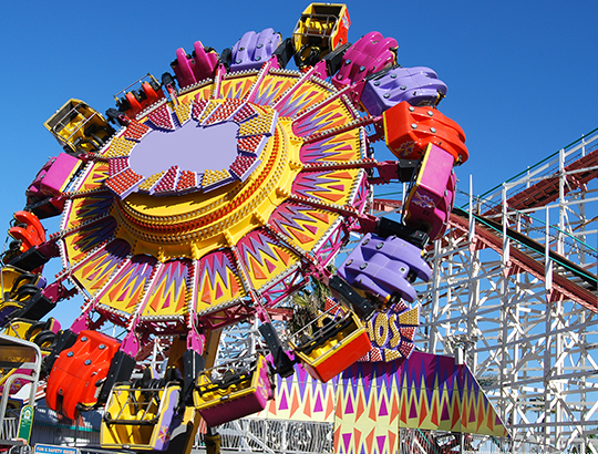 Power forward, backward and upside down while rotating around on the Control Freak ride at San Diego’s Belmont Park